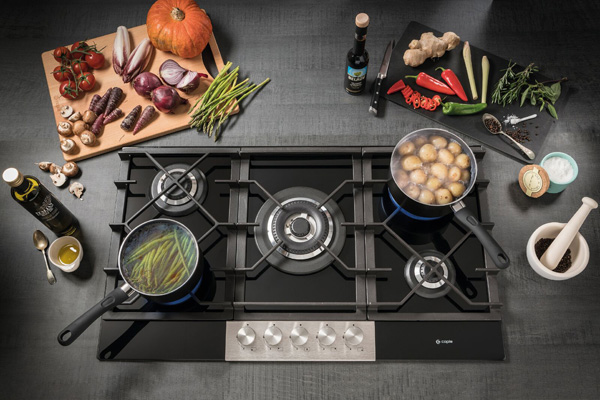 Extending its hob collection, Caple has introduced five burner gas-on-glass models which feature a stainless steel control panel. The C789C and C787G hobs measure 874mm and 700mm, respectively, but share the same features. This includes DirectHeat+ technology, where the flame is concentrated to heat the base of the pan, rather than losing heat around the outside, and auto-ignition. They boast a central 4.2kW triple ring burner, a 2.6kW rapid burner, two semi-rapid 1.75kW burners and a 1.0kW simmer burner. Completing the appliances, both gas-on-glass hobs boast cast iron pan supports 2