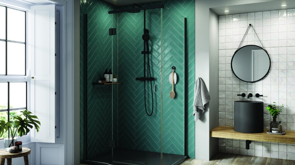 Shower enclosure with black frame and green herringbone tiles