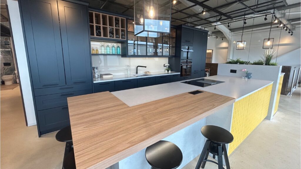 Blue Shaker kitchen with island and wooden worktop