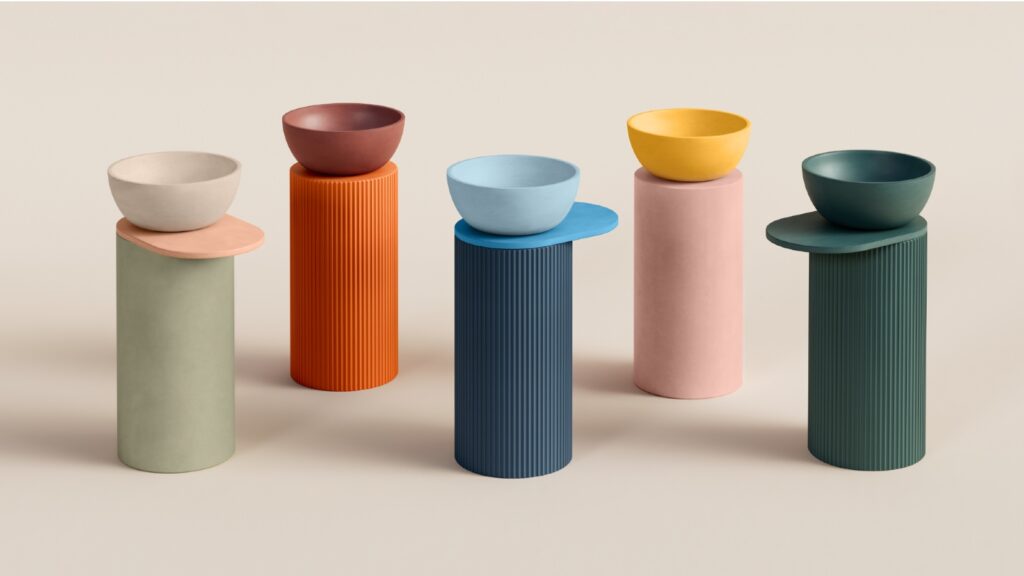 Coloured basins on different coloured pedestals, some with shelves