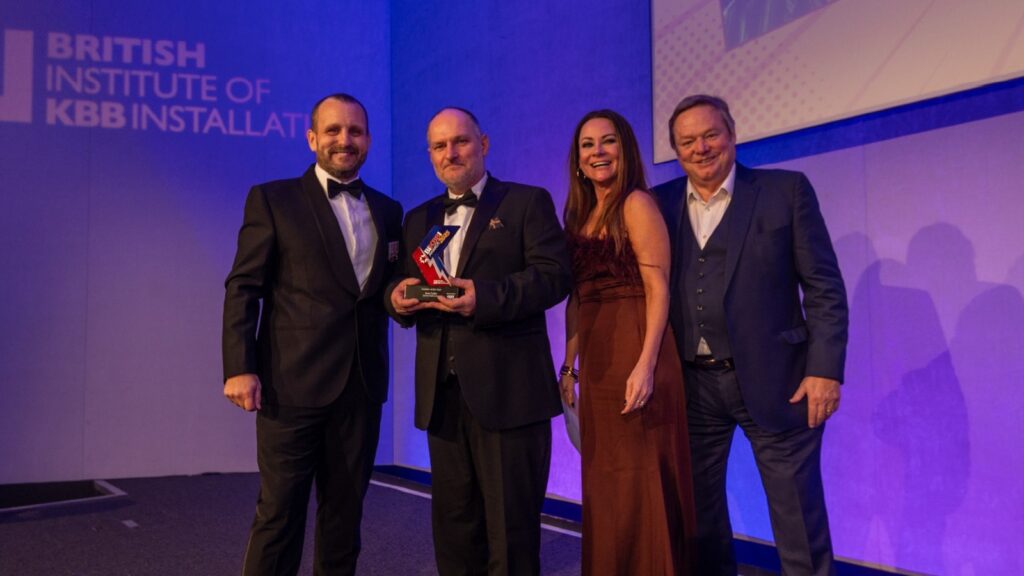 Man presented trophy at British Institute of KBB Installation Awards 